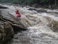 kayak going down river